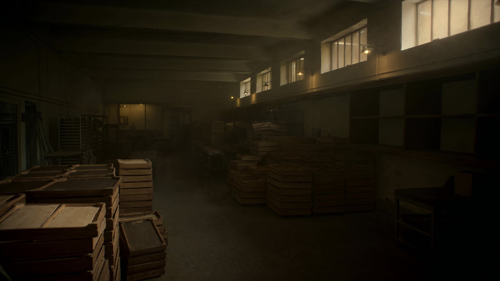 Stacked wooden bread crates in a bakery at dawn