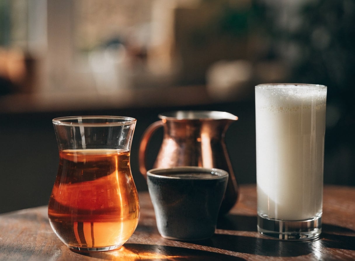 Turkish tea, coffee and ayran on a cafe table in morning light